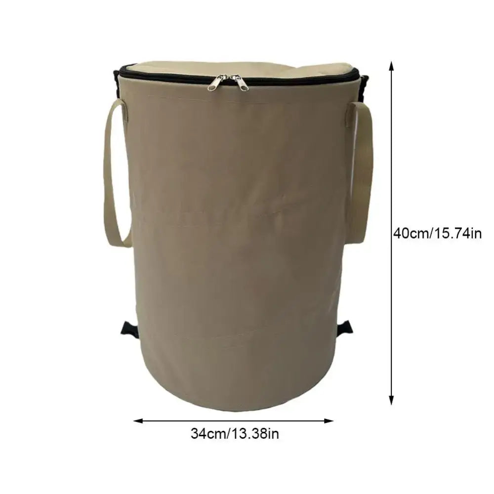 Cylindrical beige fabric storage container with a zippered top and carrying strap.