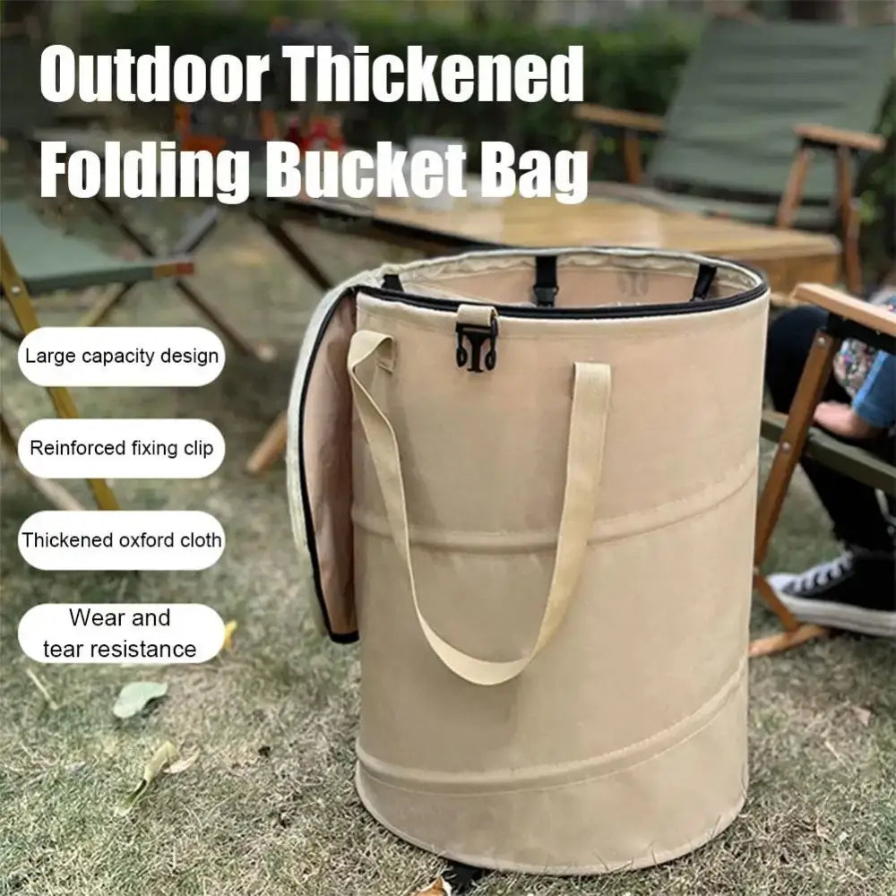 Beige cylindrical folding bucket bag with handles and reinforced rim.