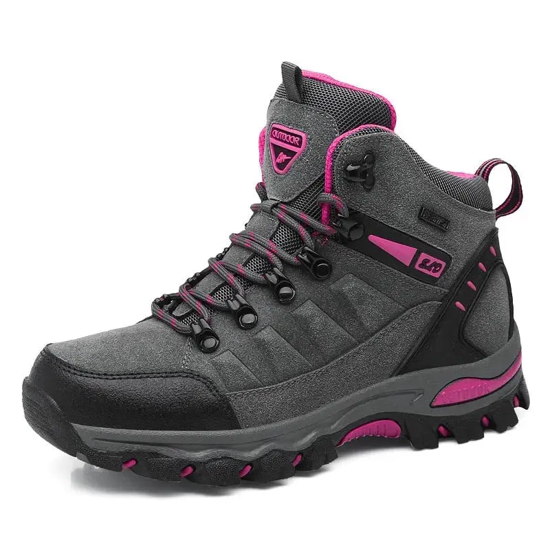 Gray and pink hiking boot with a rugged sole and lace-up design.