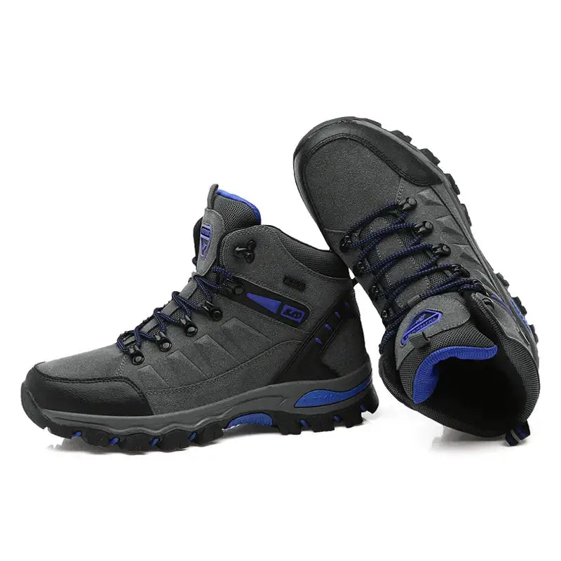 Pair of gray and blue hiking boots with rugged soles.