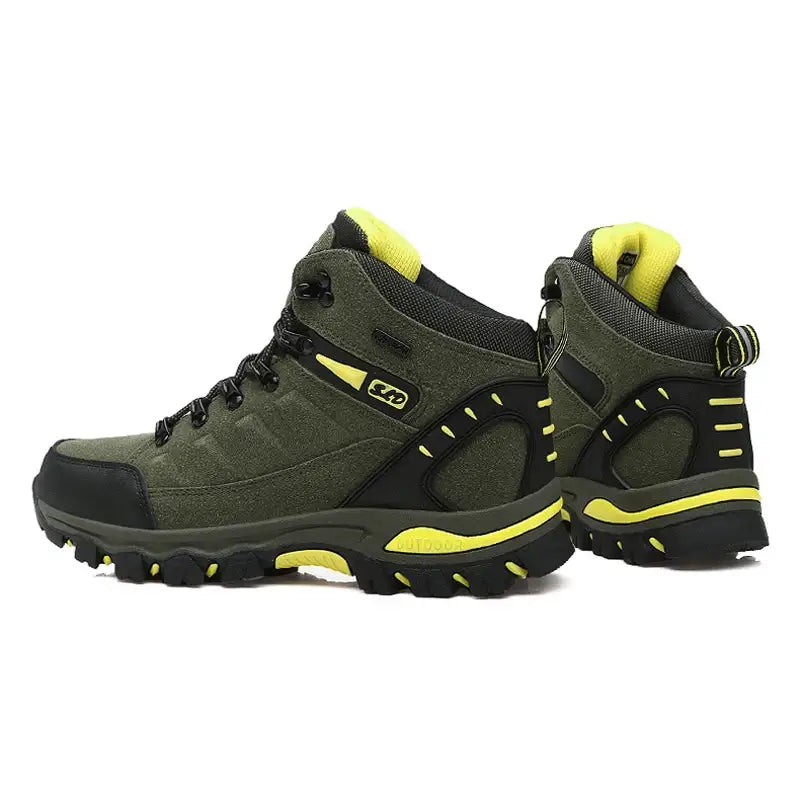 Pair of rugged hiking boots in dark green with yellow accents.