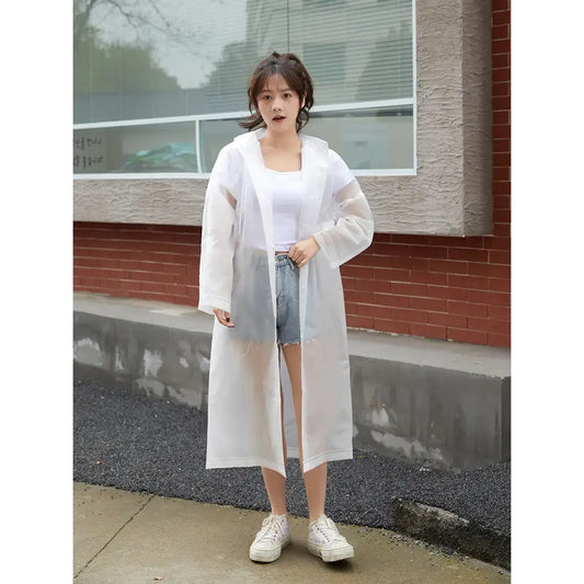 Long white sheer cardigan or duster coat worn over a casual outfit.