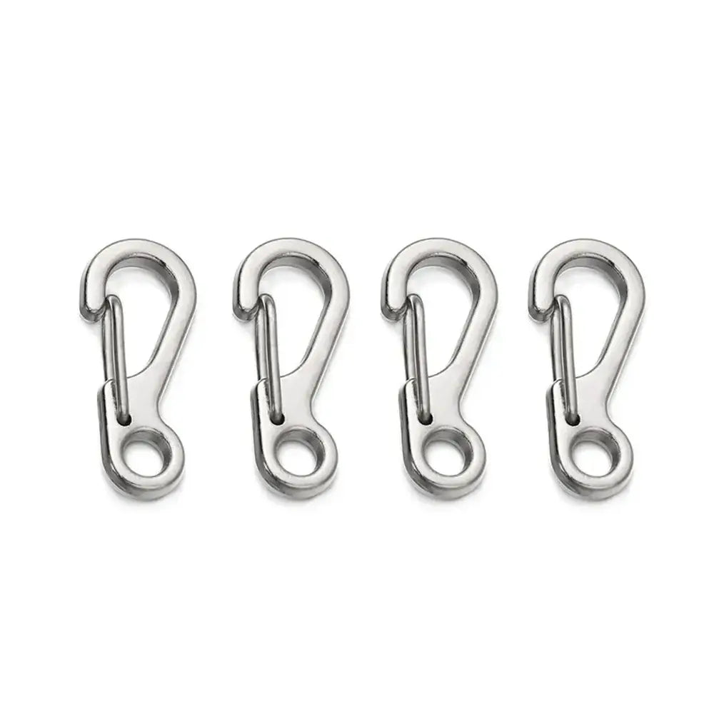 Four silver metal carabiners arranged in a row.