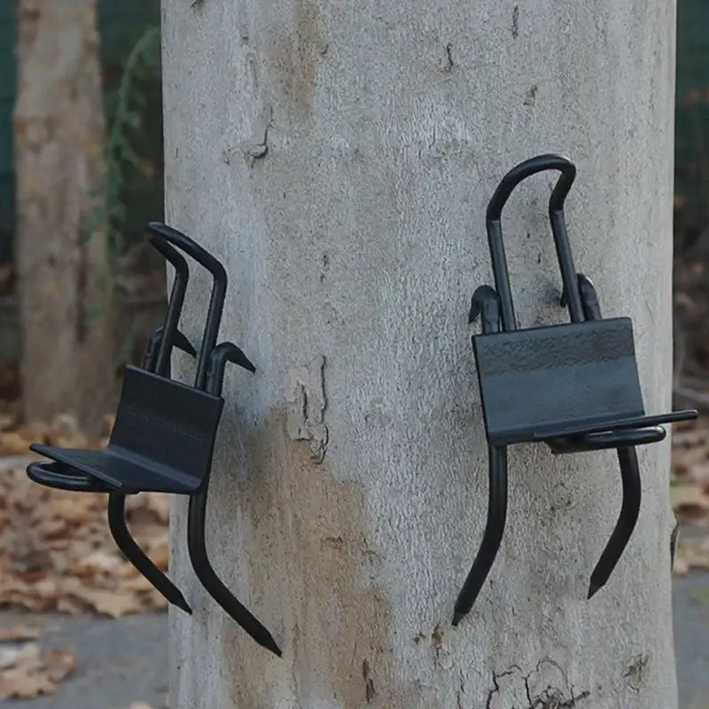 Two padlocks attached to curved metal brackets on a concrete pole.