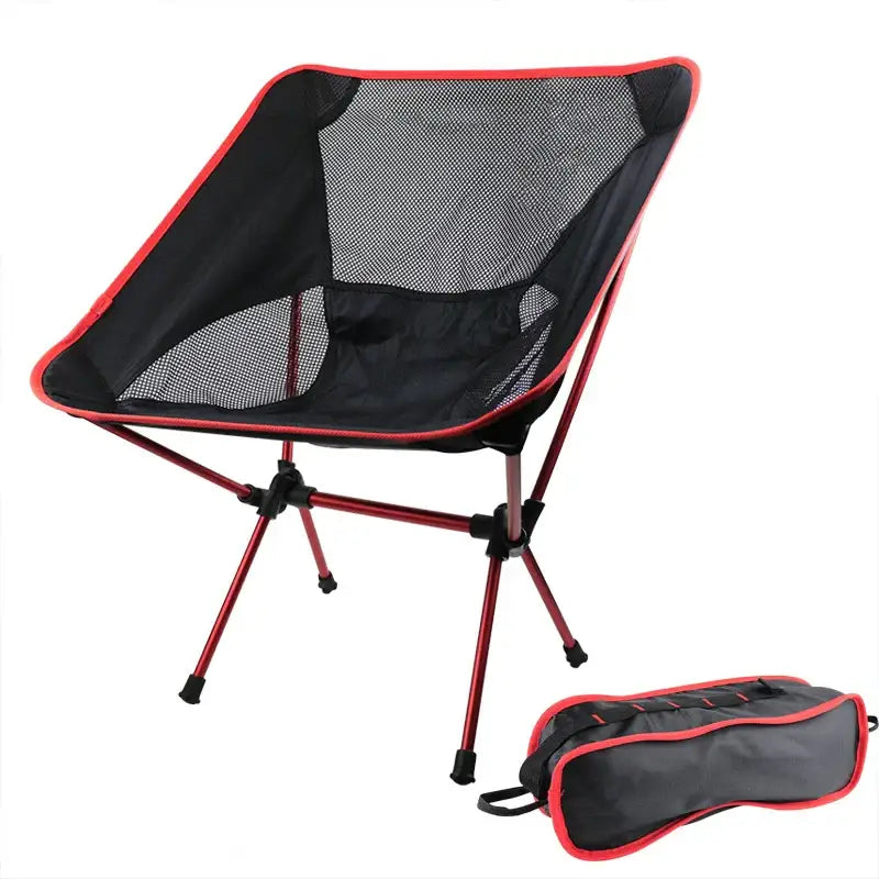 Portable folding camping chair with a mesh seat and red trim.