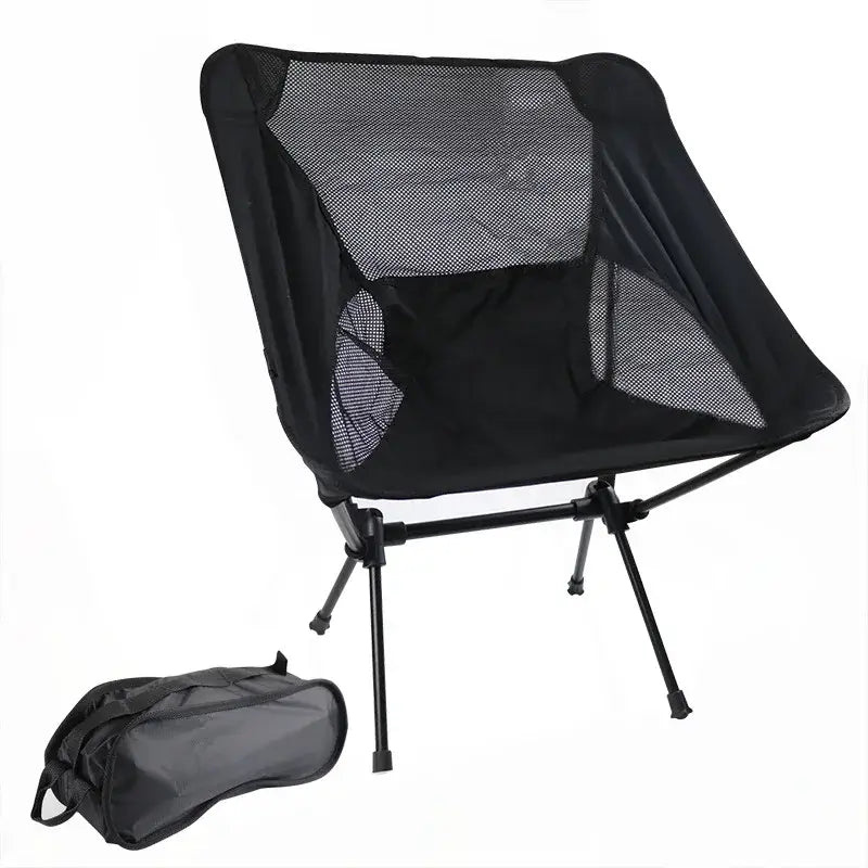 Portable folding camping chair with mesh back and seat, accompanied by a carrying bag.