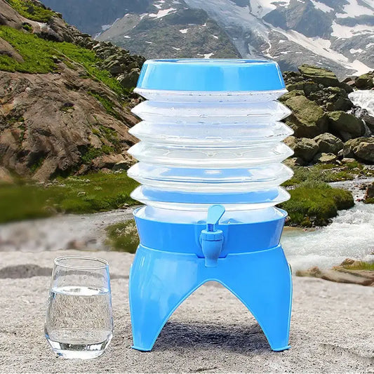 Collapsible blue water dispenser with multiple stackable sections and a spigot.