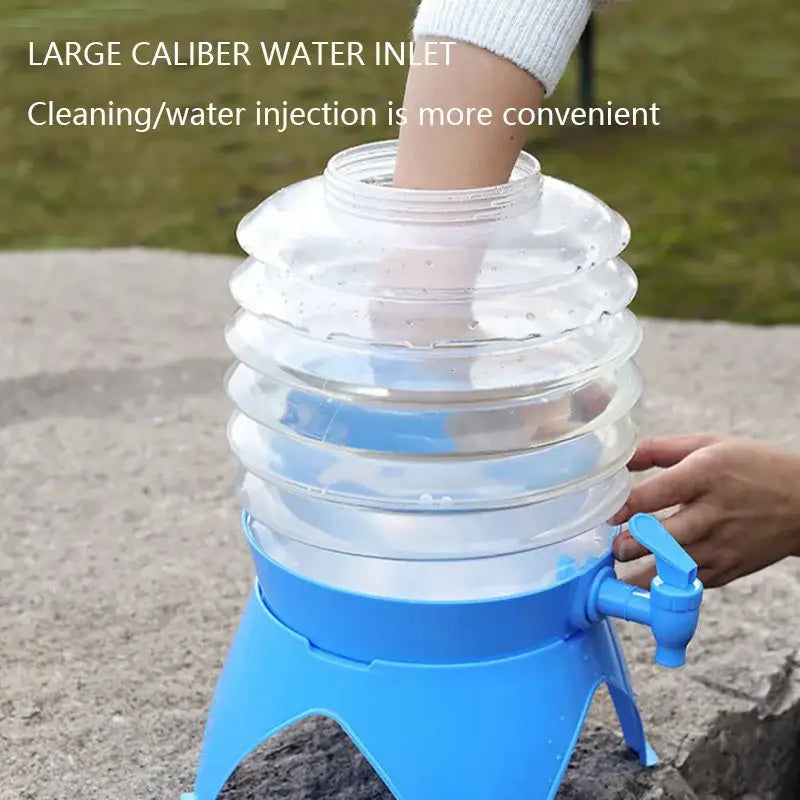 Collapsible water container with a wide mouth opening and blue base.