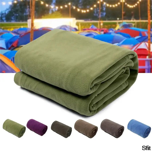 Folded green fleece blanket with smaller rolled blankets in various colors shown below.