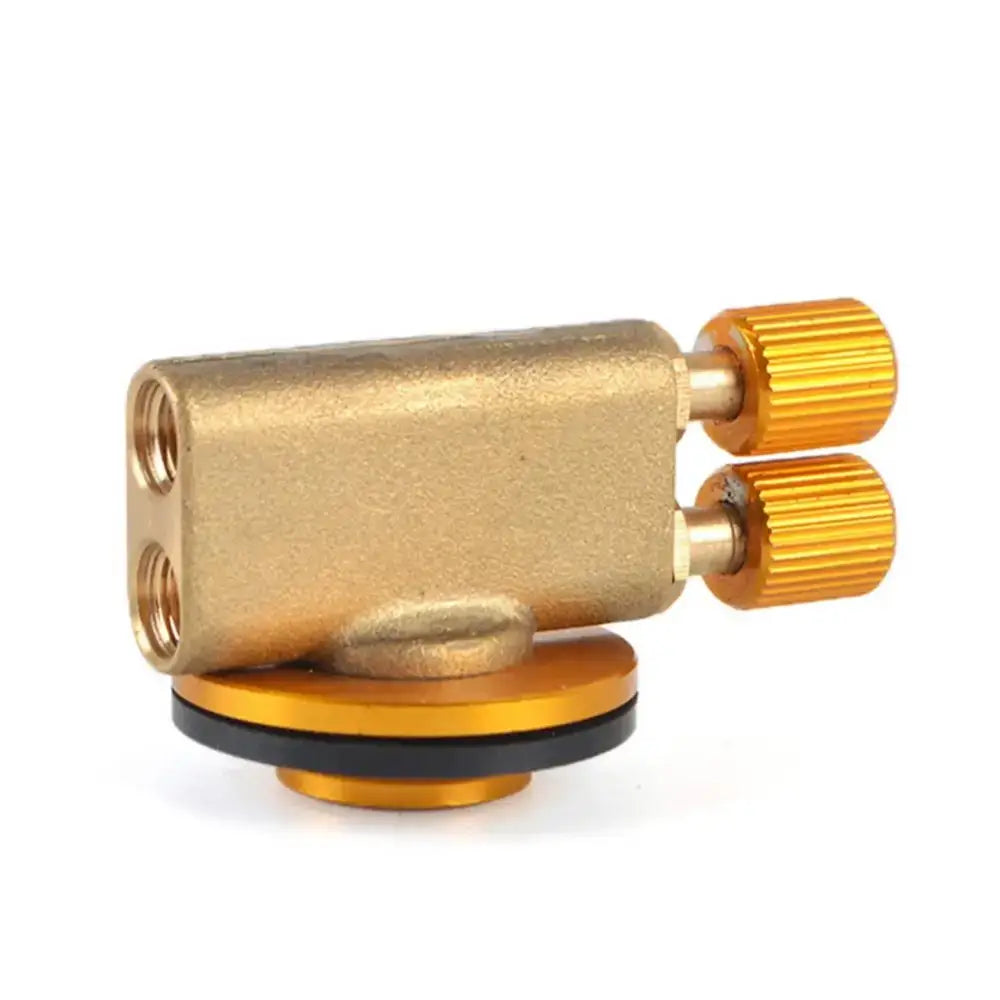 Brass gas adapter with gold-colored knobs and a circular base.