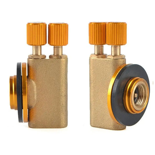 Brass gas valve or regulator with orange adjustment knobs.