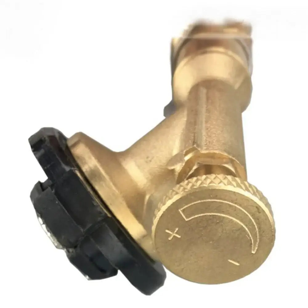 Brass faucet or valve with a circular control knob and black attachment.