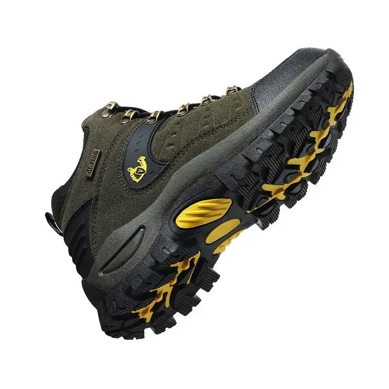 Rugged hiking boot with a dark upper and yellow accents on the sole.