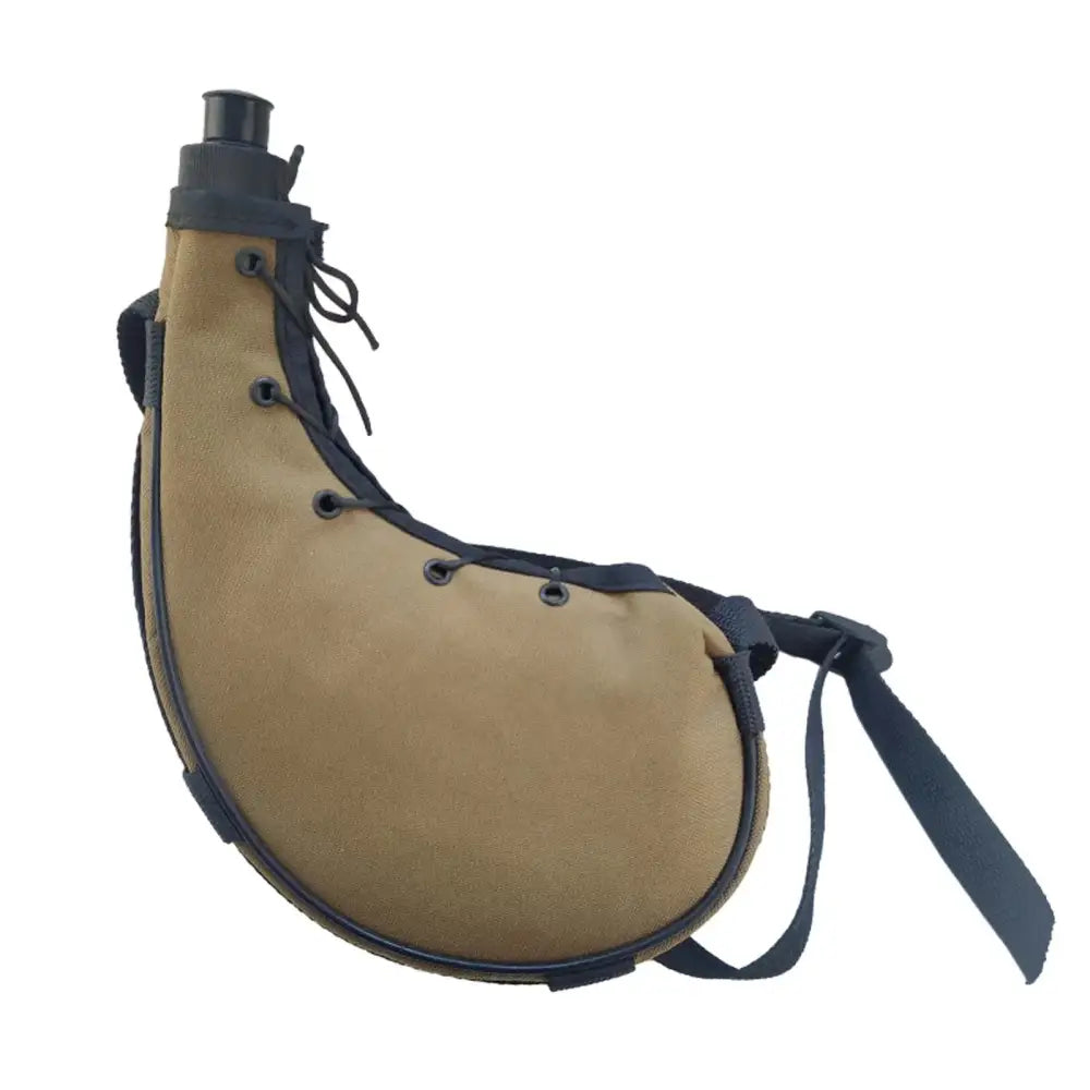 Tan leather bota bag with black trim and lacing.