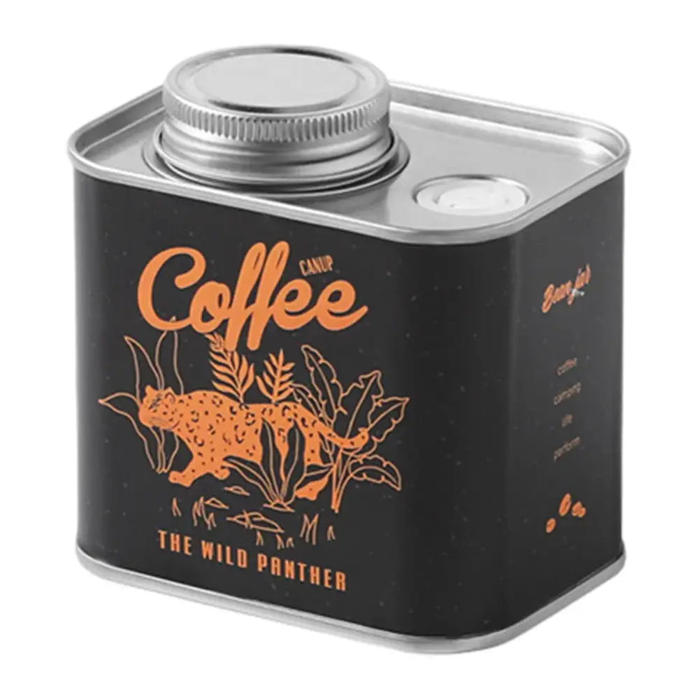 Metal canister for coffee with a black label featuring an orange panther design.