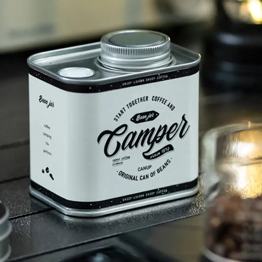 Vintage-style metal tin labeled ’Camper’ with a screw-top lid.