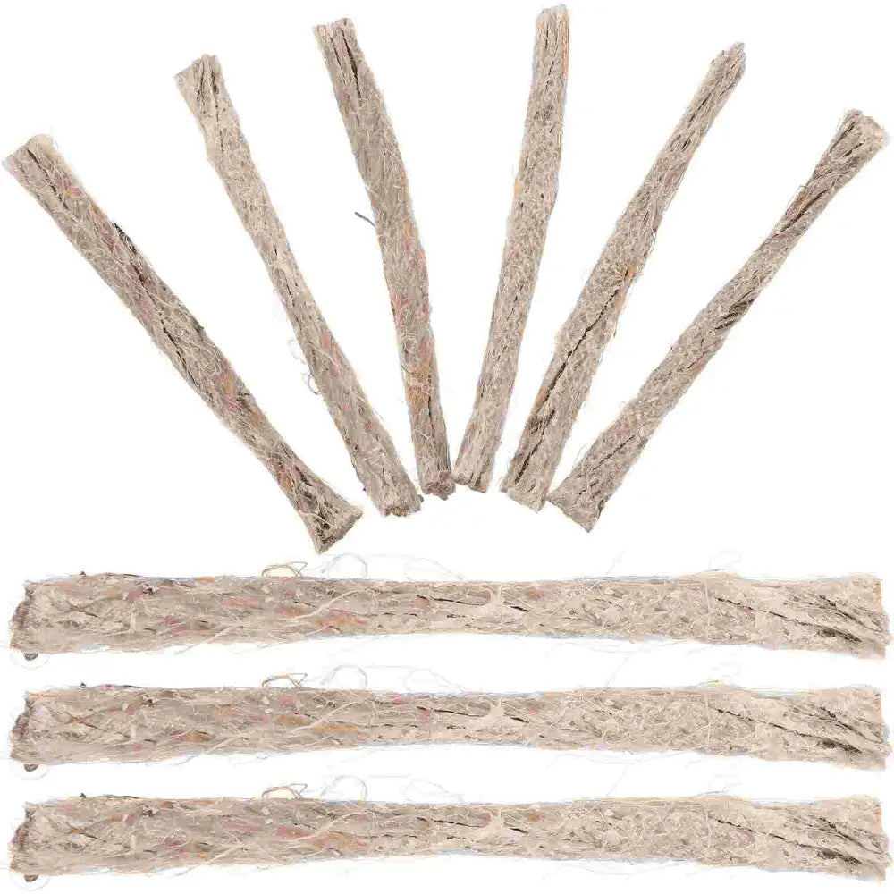 Rolled and twisted strips of light-colored natural fiber material, likely hemp or jute.