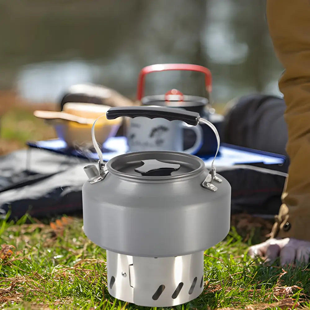 Camping kettle or portable outdoor stove with a kettle on top.