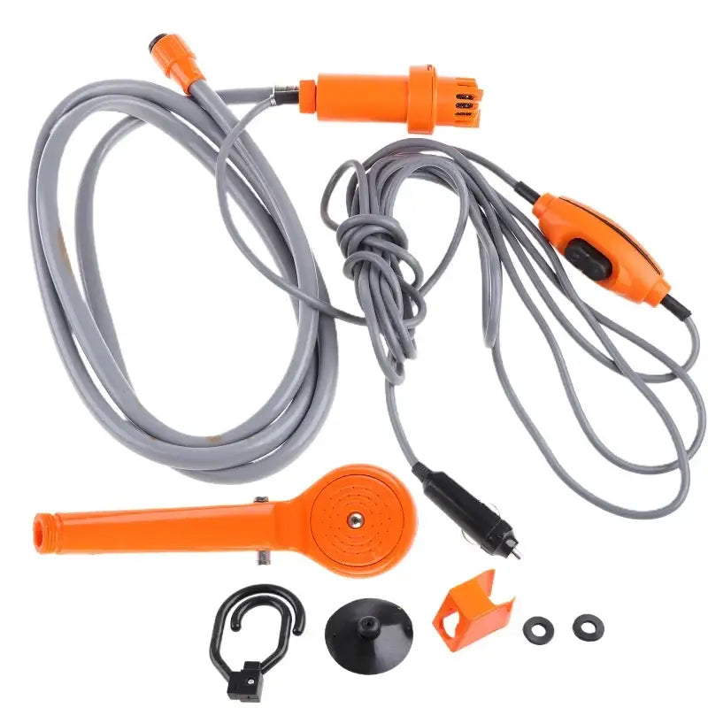 Portable electric shower with orange and gray components and various attachments.