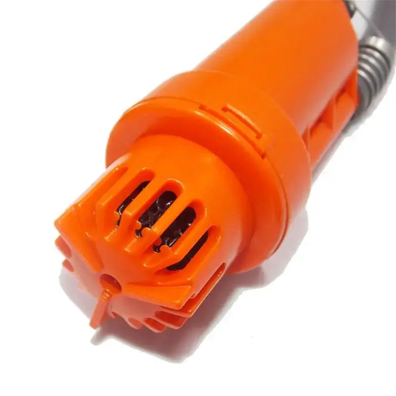 Orange plastic nozzle or attachment with slotted openings, likely part of a handheld device or tool.