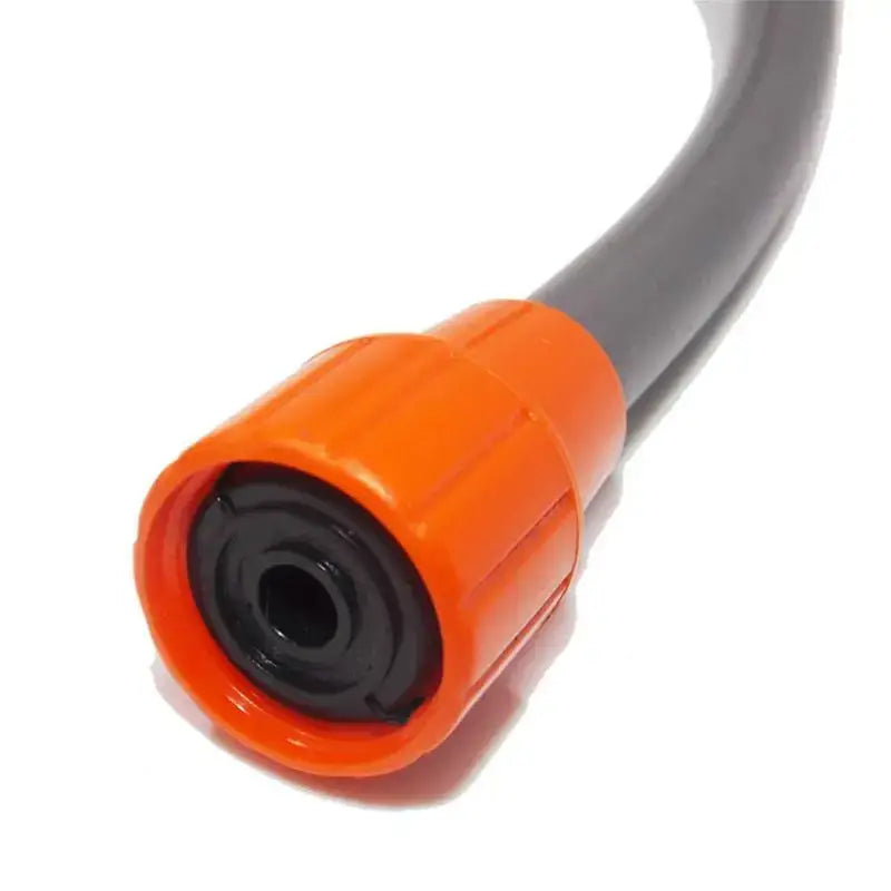 Orange-tipped nozzle or connector attached to a black hose or cable.