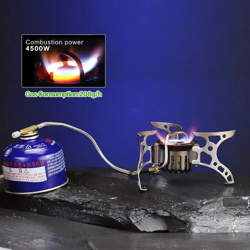 Portable camping stove with attached fuel canister and folding metal support structure.