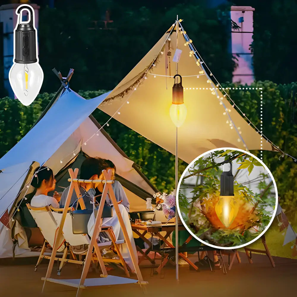 Illuminated camping tent with string lights and a hanging lantern.