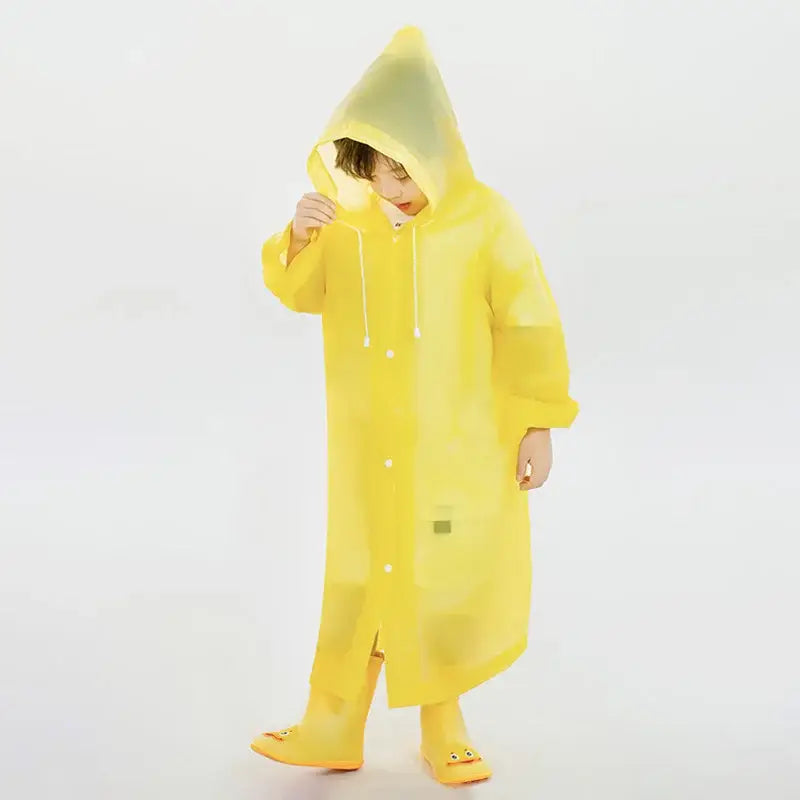 Bright yellow raincoat with matching boots worn by a child.