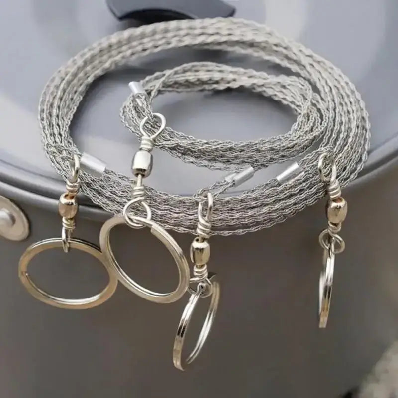 Braided silver cord with multiple key rings attached.