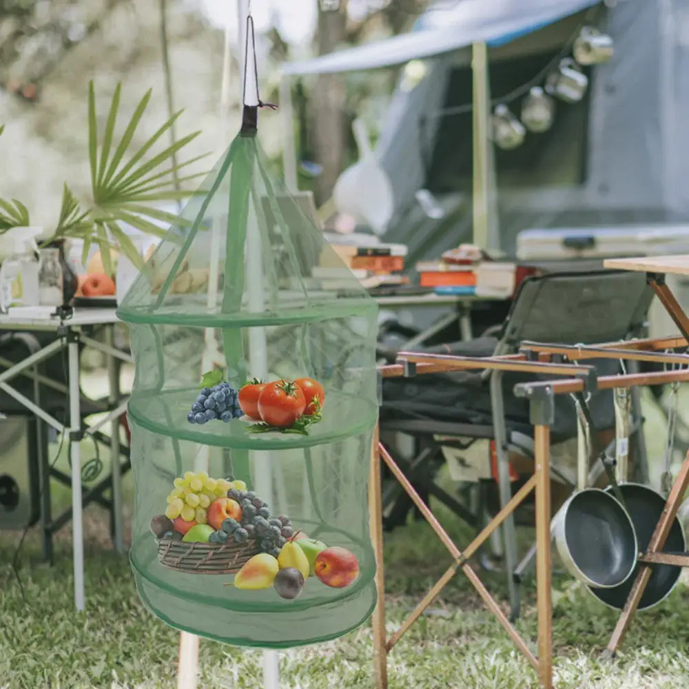 Hanging mesh produce basket filled with fruits and vegetables.