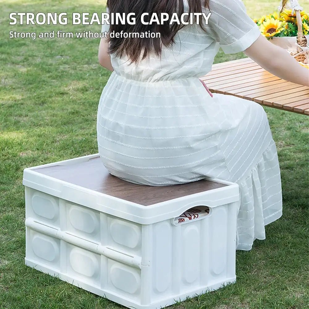 Collapsible plastic storage crate or box with a flat top surface.