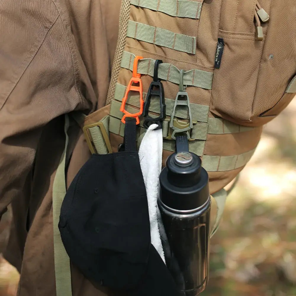 Tactical vest or military-style gear with attached accessories and pouches.