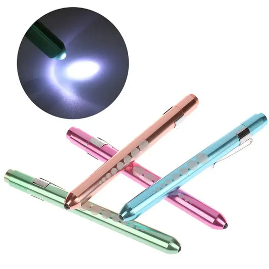 Colorful medical pen lights arranged in a crisscross pattern.