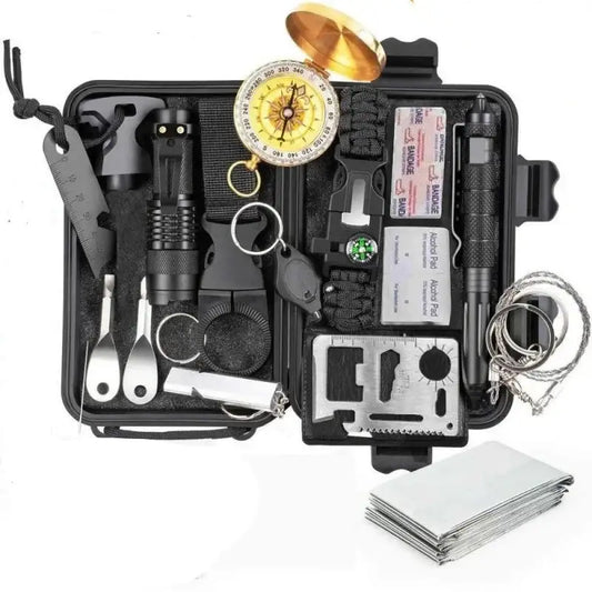 Survival kit containing various tools and equipment organized in a compact case.