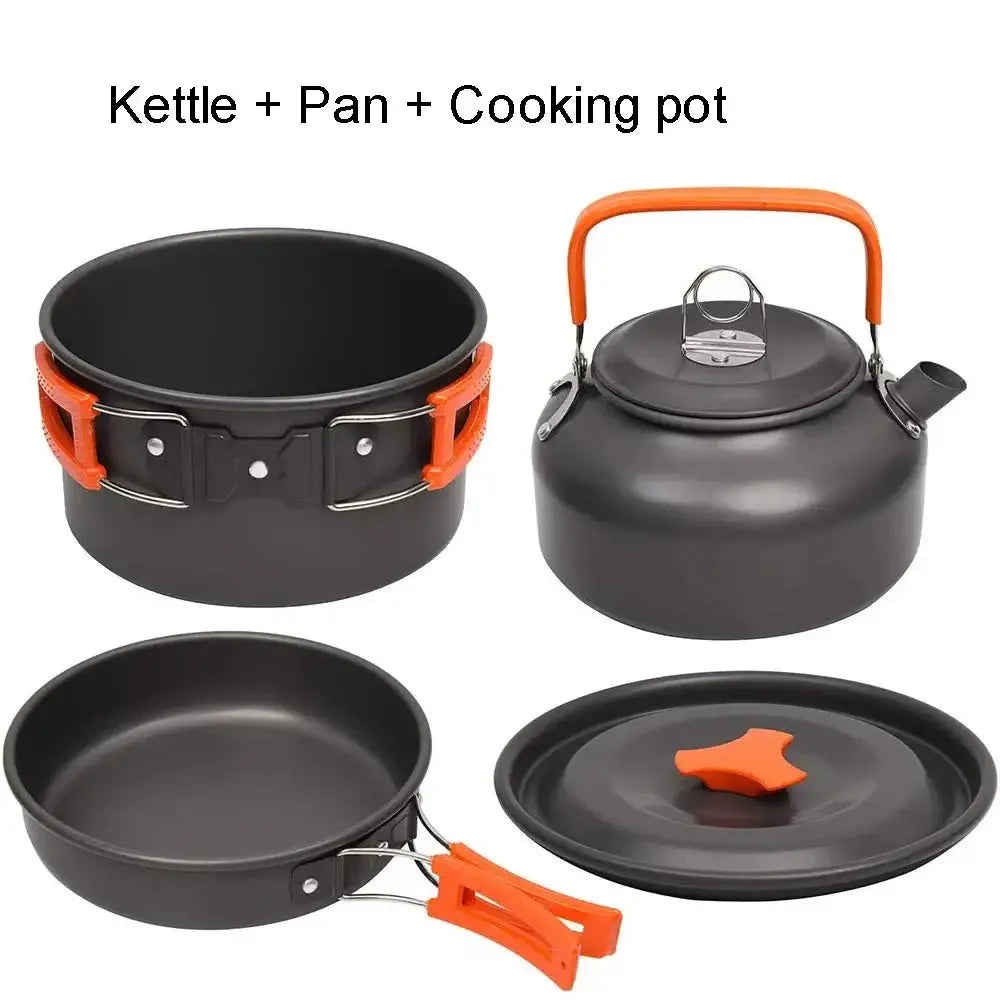 Compact camping cookware set featuring a kettle, pan, and cooking pot in black with orange accents.