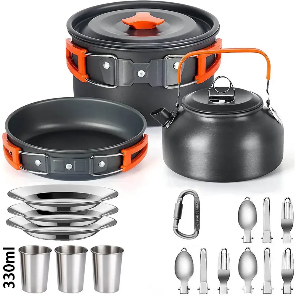 Camping cookware set featuring pots, pans, utensils, and accessories in black and orange colors.