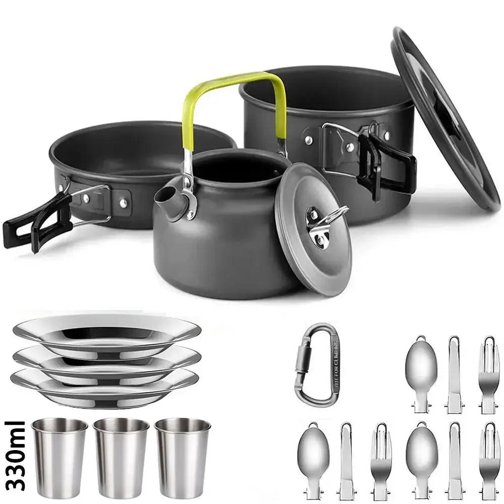 Camping cookware set including pots, pans, utensils, and cups.