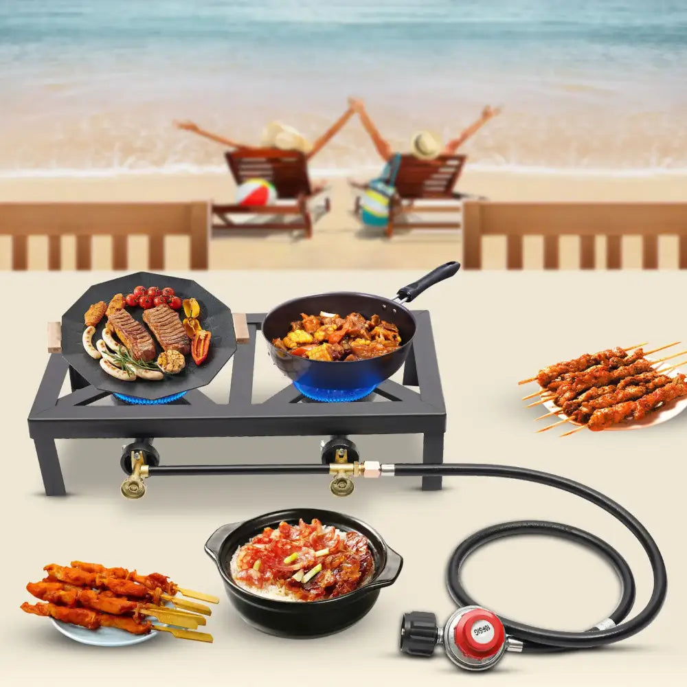 Portable camping stove with pans of food and skewers of meat.