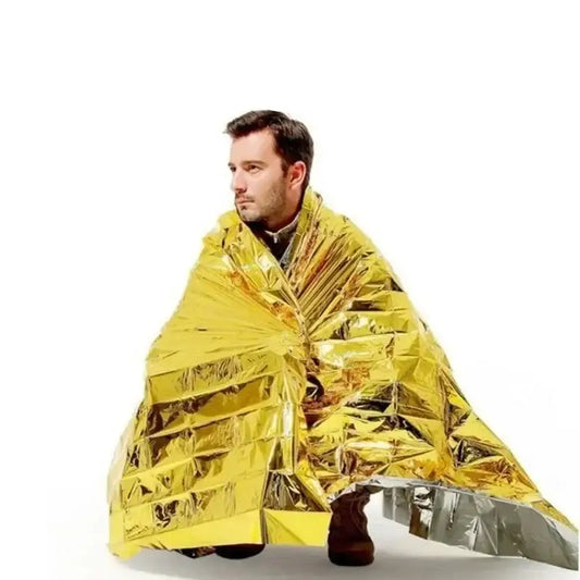 Emergency thermal blanket wrapped around a person.