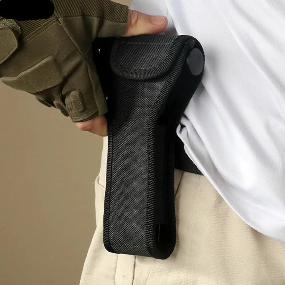 Black fabric holster or sheath attached to a belt.