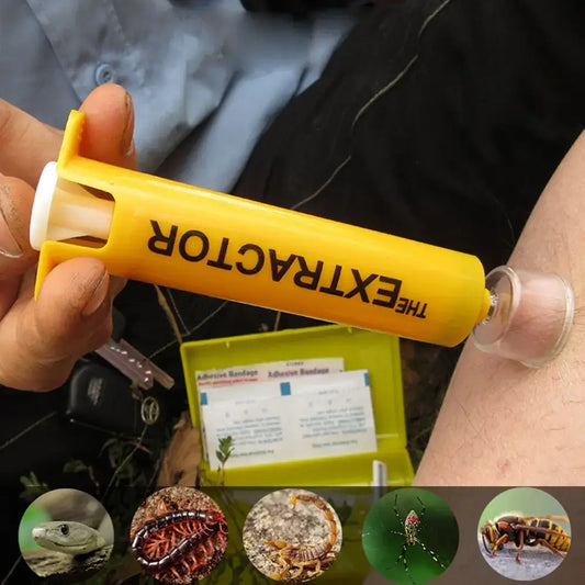 Yellow plastic tube labeled ’THE EXTRACTOR’ held between fingers.