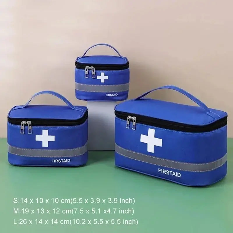 Blue first aid kits with white cross symbols in three different sizes.