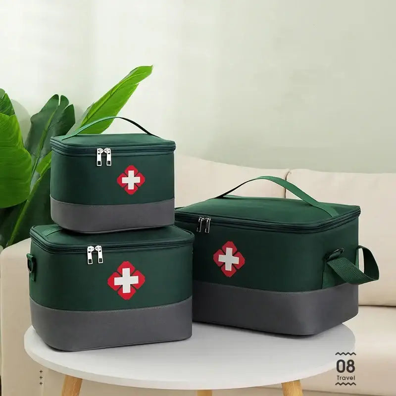 Set of three green first aid kits with red cross symbols.