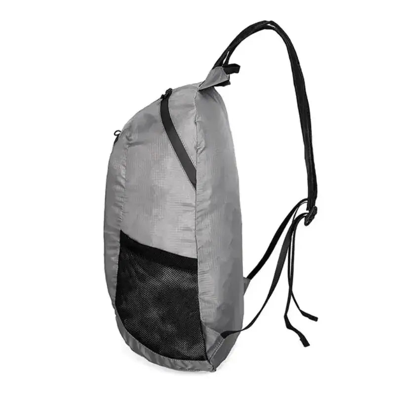 Gray backpack with black straps and mesh side pocket.