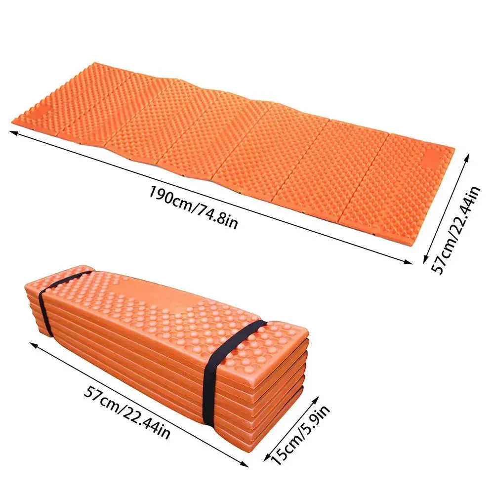 Orange foam camping sleeping pad that folds into a compact rectangle for easy transport.