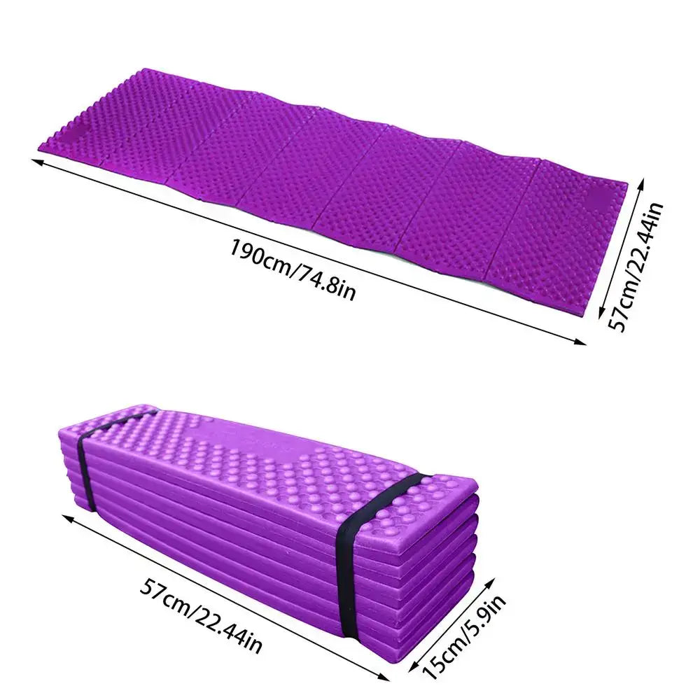 Purple foam camping or exercise mat that can be folded or rolled up for storage.