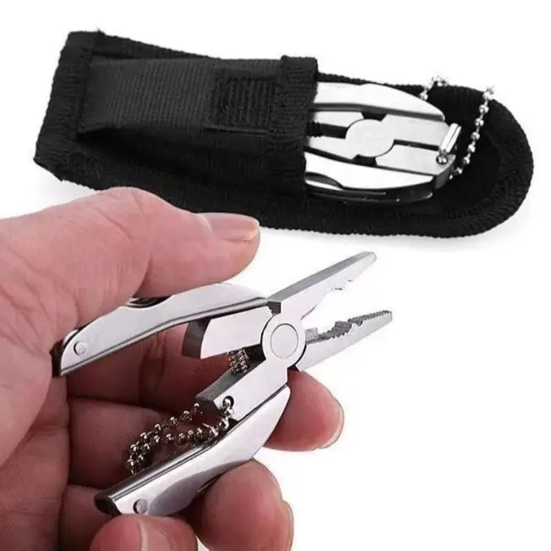 Compact multi-tool with pliers and folding components in a black carrying case.