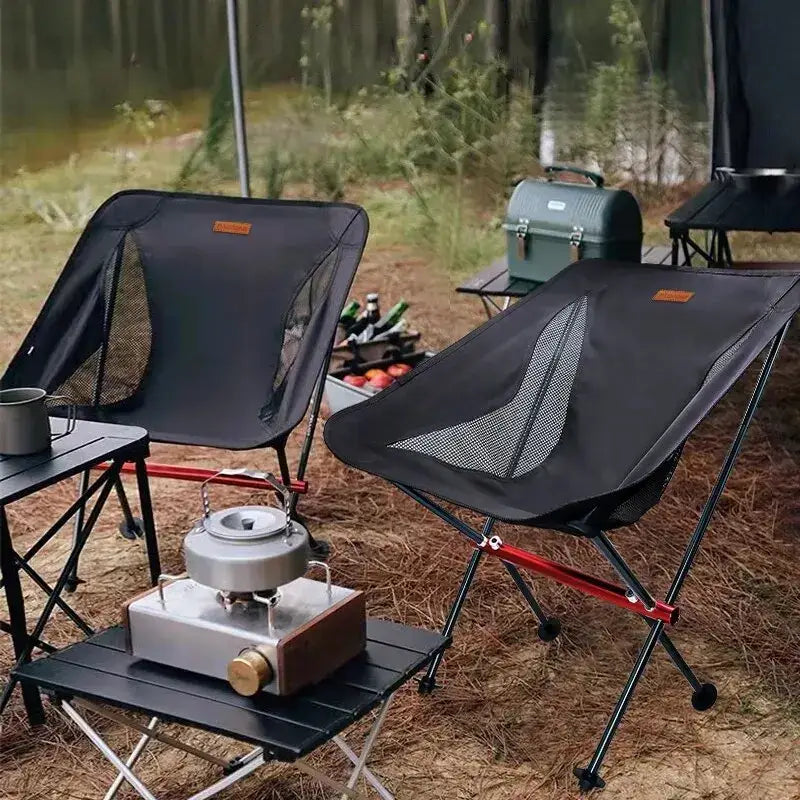 Portable camping chairs with black mesh seats and metal frames.