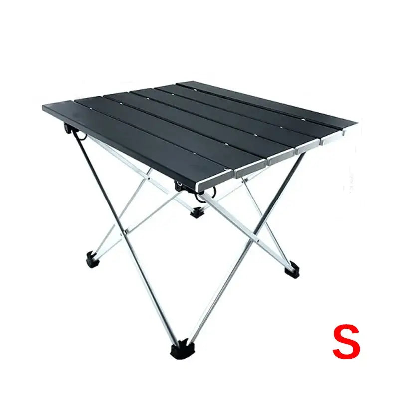 Portable folding camping table with a black aluminum top and lightweight frame.