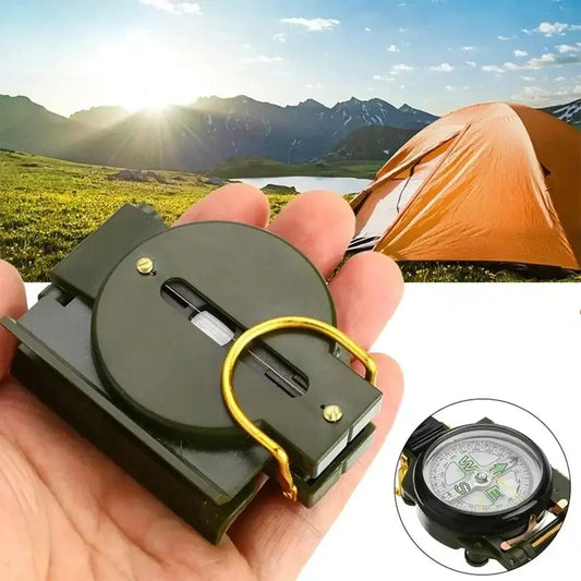 Handheld compass with a folding lid held in an open palm.